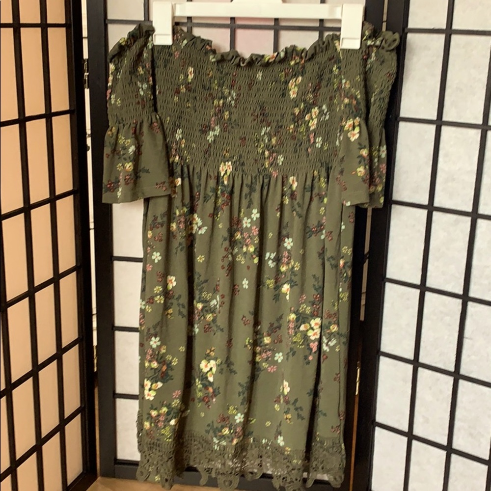 Cute green off the shoulder dress.